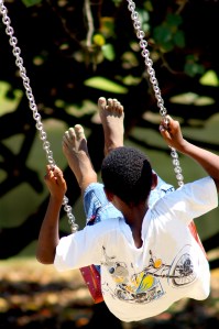 boy swinging